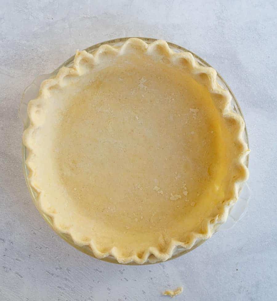 This buttery and flaky all butter pie crust is such a simple recipe with just 4 ingredients, and the perfect crust for all your favorite pies! Get you homemade pie baking on with this super simple, super perfect pie crust made without any shortening as the fat -- just butter! #butterpiecrust #piecrust #piecrustrecipe #pie #pierecipe #allbutterpiecrust #holidaybaking #pies