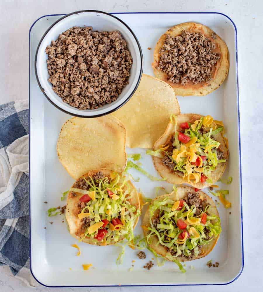 Beef tostadas are a delicious and savory weeknight meal if you ever want a Mexican-inspired dish that comes together quickly and tastes absolutely amazing! #tostadas #beeftostadas #texmex