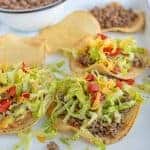 beef tostadas on a white plate