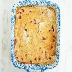 top view of cherry dump cake in a white and blue baking dish