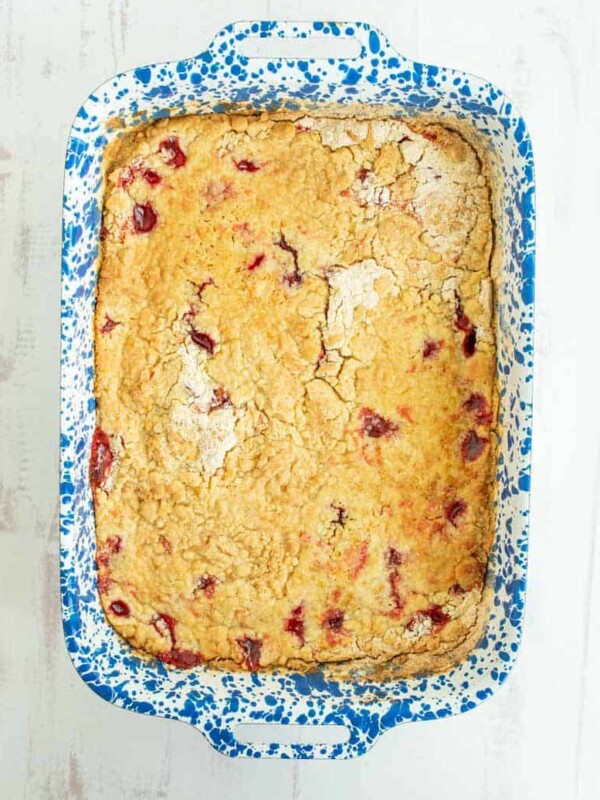 top view of cherry dump cake in a white and blue baking dish