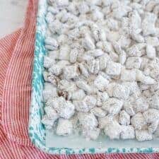 baking dish of lightly white dusted chex mix