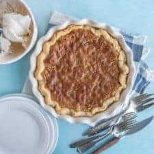 crumbly top toll house pie in a white pie dish