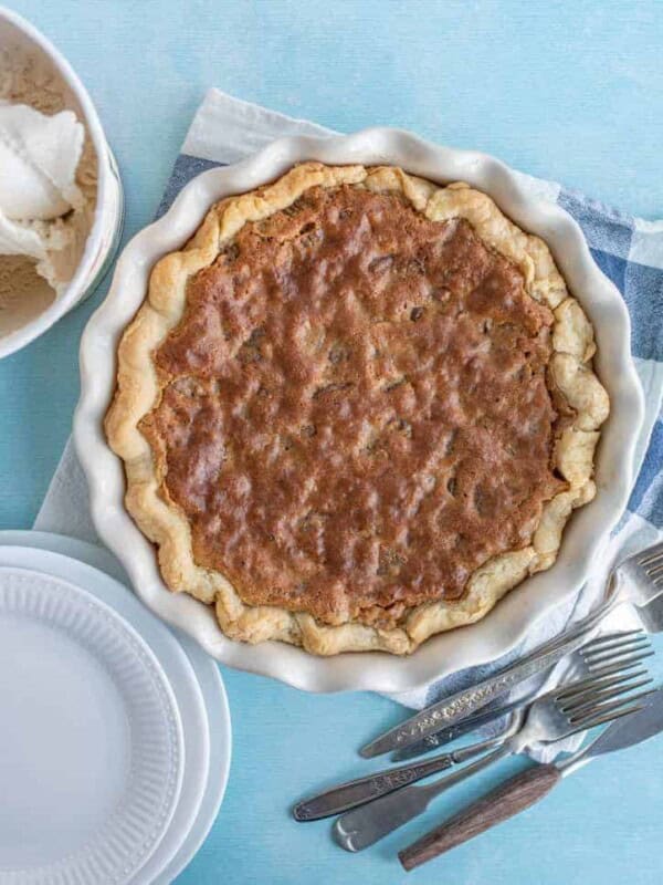 crumbly top toll house pie in a white pie dish