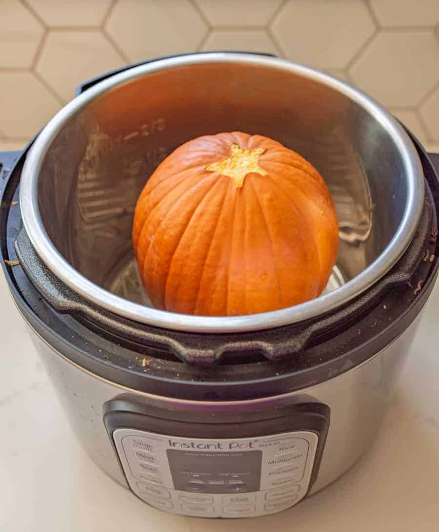 Learn how to cook pumpkin in the Instant Pot with this simple guide, so you can enjoy all the pumpkin soups, pies, and other fall recipes you and your family love! It's a cinch (and so fast) to cook pumpkin in the Instant Pot -- easy enough that you'll find yourself ditching the canned store-bought kind! #pumpkin #pumpkinpuree #pumpkinrecipes #pumpkininstantpot #instantpot #instantpotrecipes