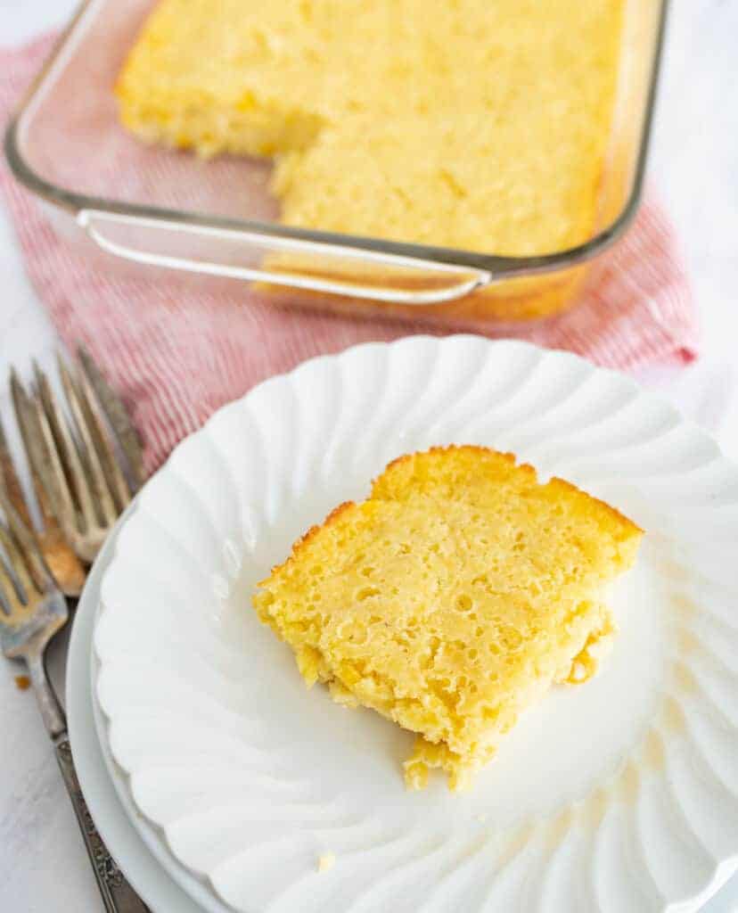 corn bread pudding on a white plate