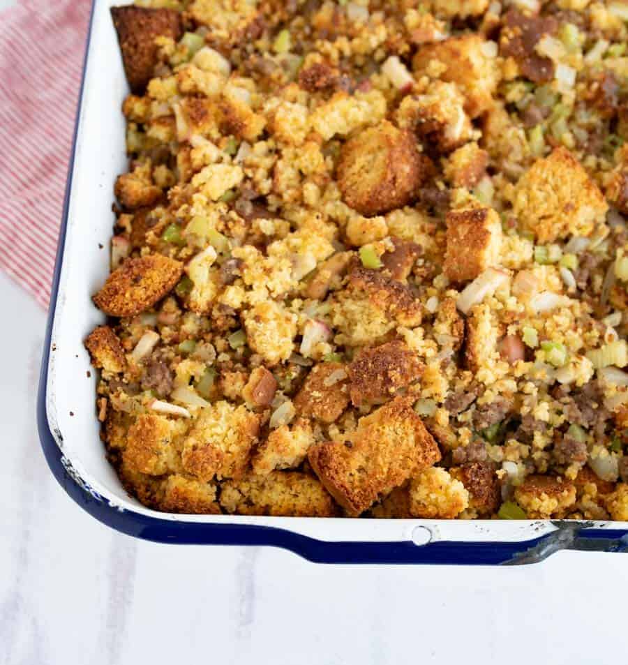 Cornbread stuffing is a crumbly and flavor-packed holiday side dish that's simple to prepare and delicious to enjoy! With sausage, onion, apple, and celery to complete it, this cornbread stuffing is chock-full of fall flavors and is majorly easy to whip up as a side for your holiday feast. #stuffing #dressing #cornbreadstuffing #cornbreaddressing #cornbread #thanksgivingsides #thanksgiving #thanksgivingrecipes #holidayrecipes