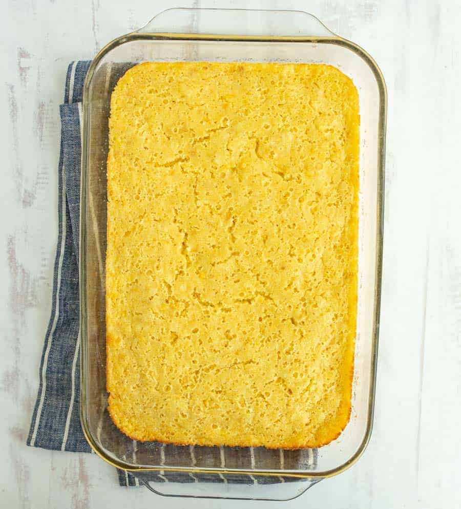 Easy creamed corn casserole is a buttery and creamy dish that's a perfect Thanksgiving side and the absolute easiest casserole to make ever (and that's saying a lot -- casserole is notoriously easy!). This fluffy and rich casserole is such a fun take on a corn side dish, and it's super hearty, delicious, and comes together simply. #corncasserole #creamedcorncasserole #casserole #creamedcorn #thanksgivingdishes #thanksgivingsides #thanksgivingrecipes #holidaydishes