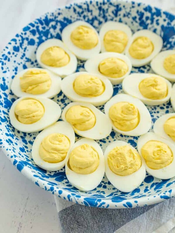 deviled eggs on a blue and white plate