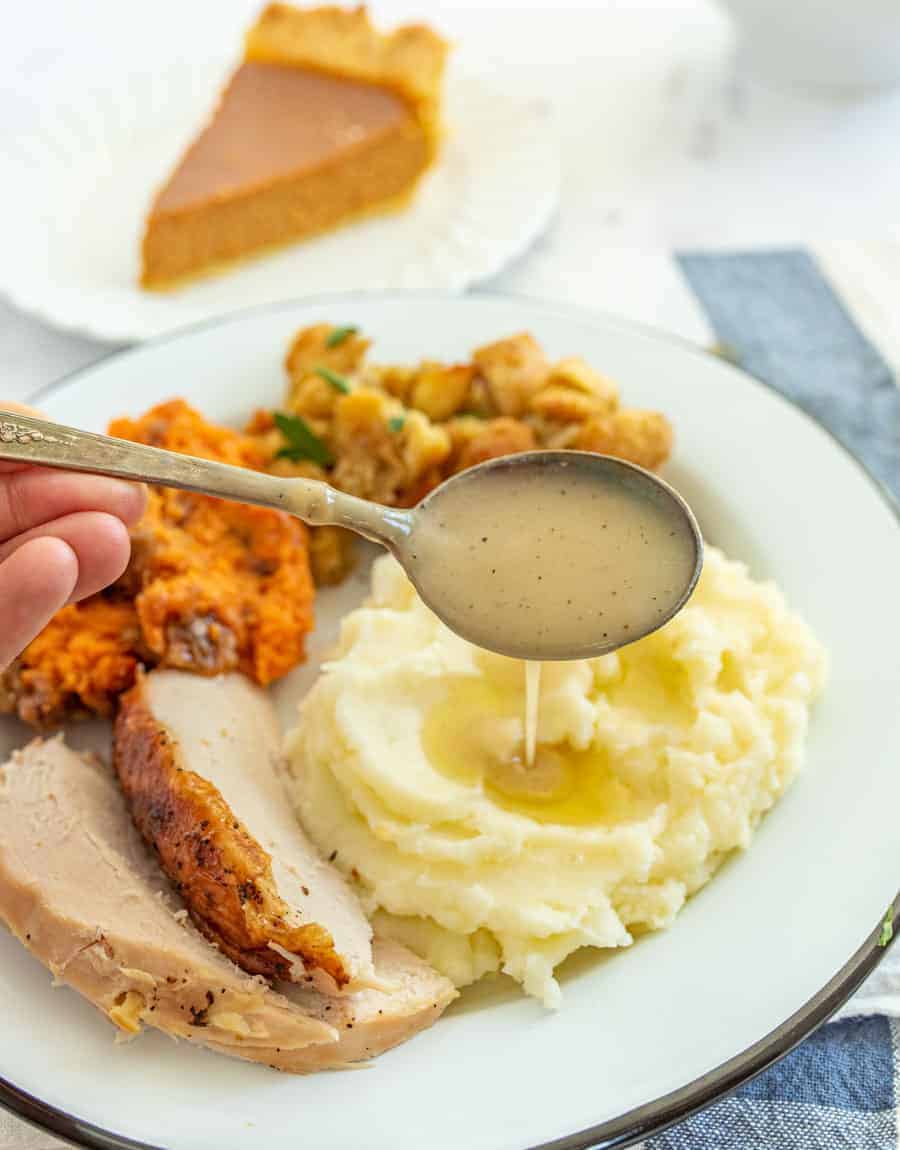 This simple and flavorful homemade gravy comes together quickly using the leftover drippings from a roast turkey or roast turkey breast! You can simply whip this up in a few minutes before you serve a delicious holiday feast to family and friends with the use of a few pantry staple ingredients and the drippings from turkey! #gravy #turkeygravy #thanksgiving #thanksgivingrecipes #homemadegravy #gravyrecipe #holidayrecipes