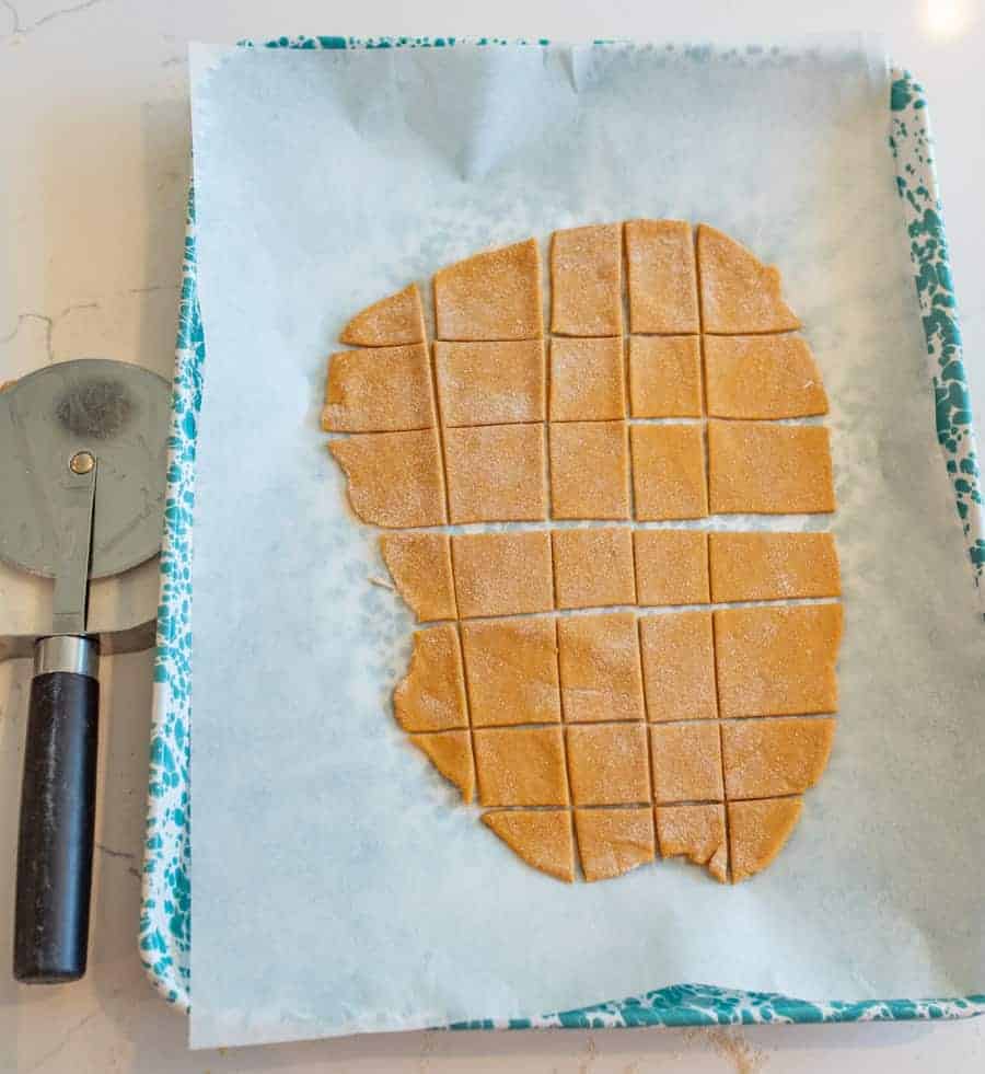 pumpkin dough rolled out, cut into squares.