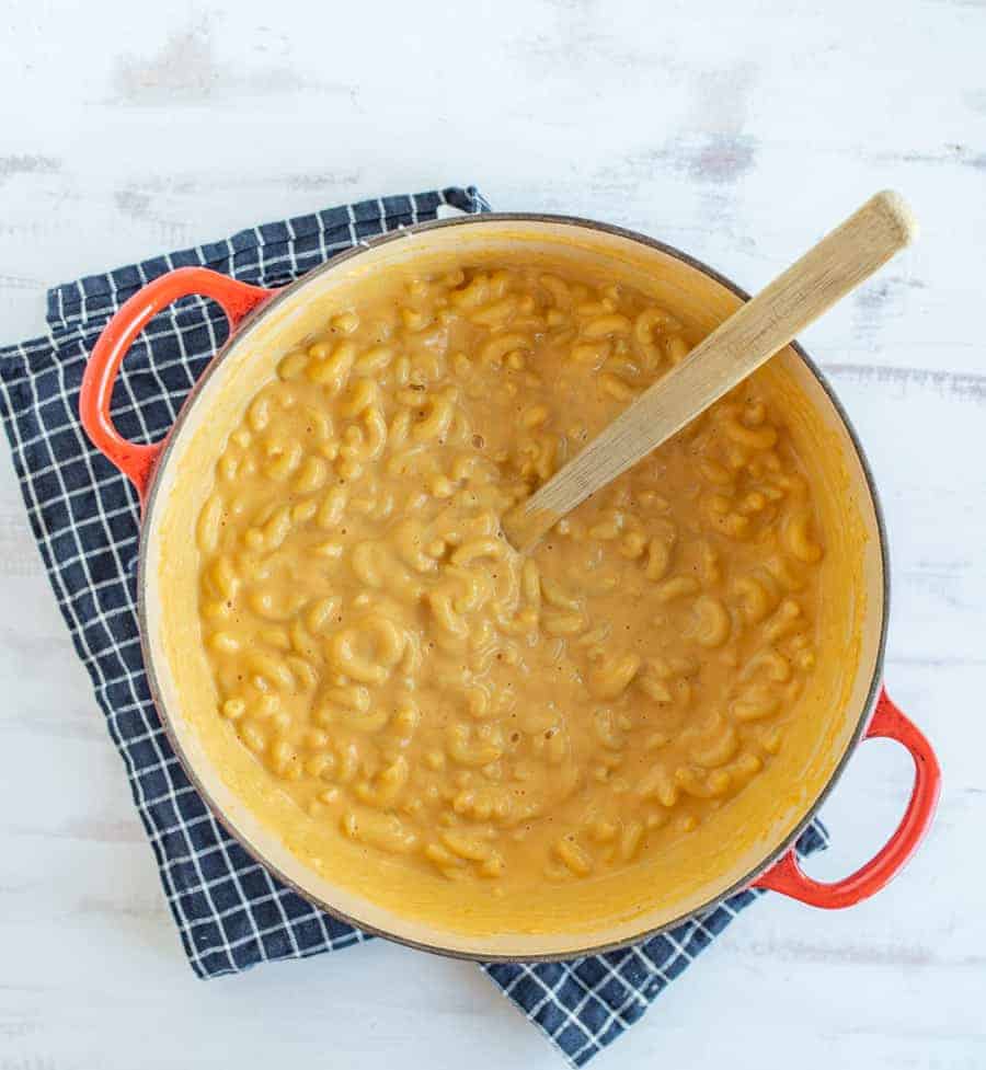 Quick and easy pumpkin macaroni and cheese is such a delicious classic meal with a fun (and easy to hide) twist to infuse a healthy veggie into this forever favorite family dish! #macandcheese #pumpkinmacandcheese #pumpkinrecipes #macaroniandcheese #pasta #pumpkinpasta