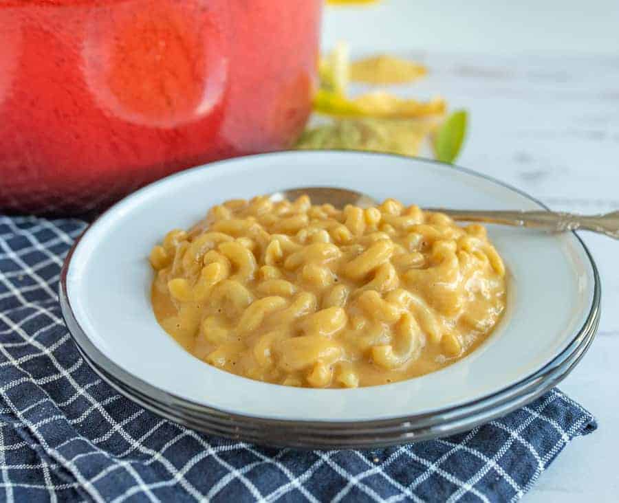 Quick and easy pumpkin macaroni and cheese is such a delicious classic meal with a fun (and easy to hide) twist to infuse a healthy veggie into this forever favorite family dish! #macandcheese #pumpkinmacandcheese #pumpkinrecipes #macaroniandcheese #pasta #pumpkinpasta