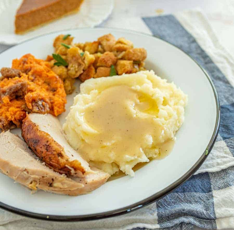 This simple and flavorful homemade gravy comes together quickly using the leftover drippings from a roast turkey or roast turkey breast! You can simply whip this up in a few minutes before you serve a delicious holiday feast to family and friends with the use of a few pantry staple ingredients and the drippings from turkey! #gravy #turkeygravy #thanksgiving #thanksgivingrecipes #homemadegravy #gravyrecipe #holidayrecipes