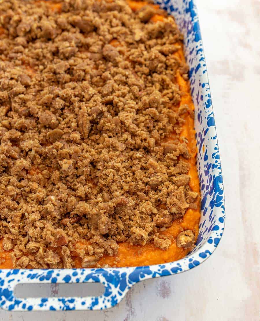 topping with pecans before it has been baked