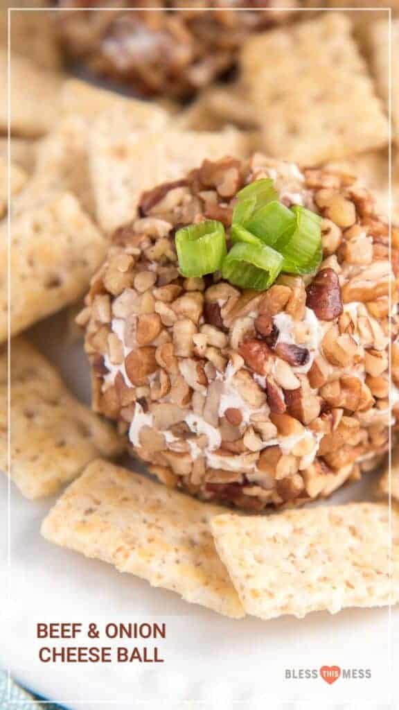 Title Image for Beef & Onion Cheese Ball and a white round plate with a beef and onion cheese ball surrounded by crackers and topped with scallions