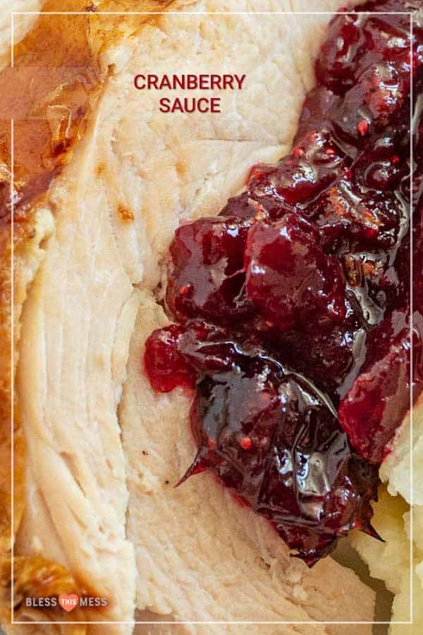 Sweet and tart with some citrusy tang, this easy homemade cranberry sauce is heavenly on a holiday dinner plate and is a simple side to prepare ahead of time! Simmering together a handful of ingredients on the stove is all it takes to make an irresistible cranberry sauce that you'll be dying to make for every holiday celebration! #cranberrysauce #cranberries #cranberrysaucerecipe #thanksgivingrecipe #thanksgivingdish #thanksgivingside #holidayrecipes