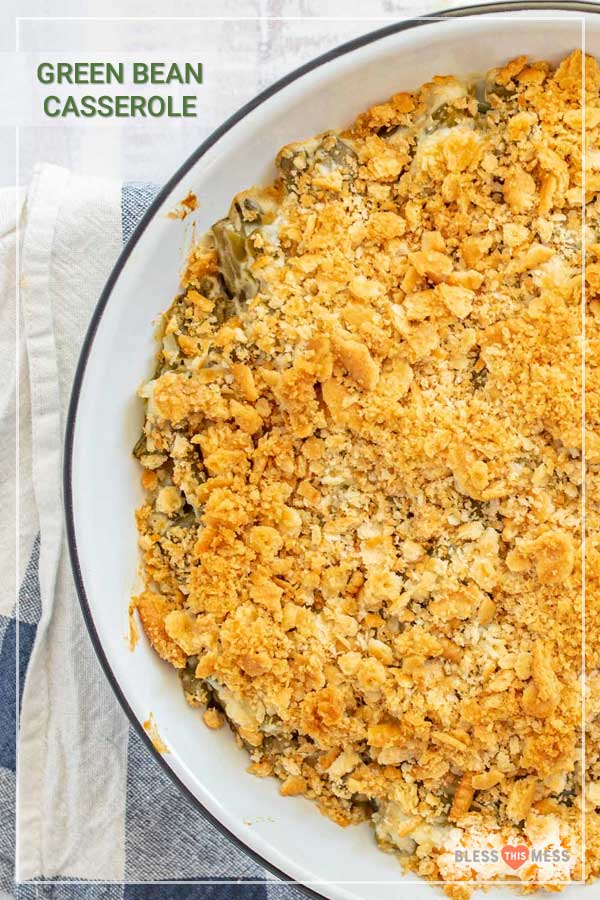 Title Image for Green Bean Casserole with top view of a round baking dish of green bean casserole with crumbly topping