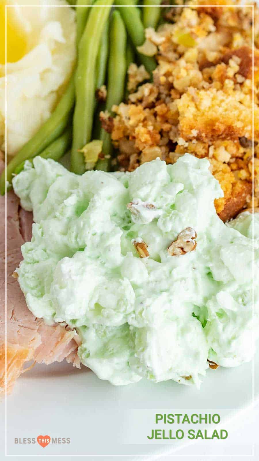 This 4 ingredient pistachio salad is a perfect and easy sweet salad for your holiday meal, and it takes just a few minutes to make! Don't let the green color fool you -- this is a perfect sweet salad to complement all the savory dishes served up for holiday meals, and it comes together so easily! #pistachiosalad #pistachiosaladrecipe #homemadepistachiosalad #pistachiopudding #holidaydishes #thanksgivingdishes #fruitsalad #ambrosiasalad #thanksgivingrecipes