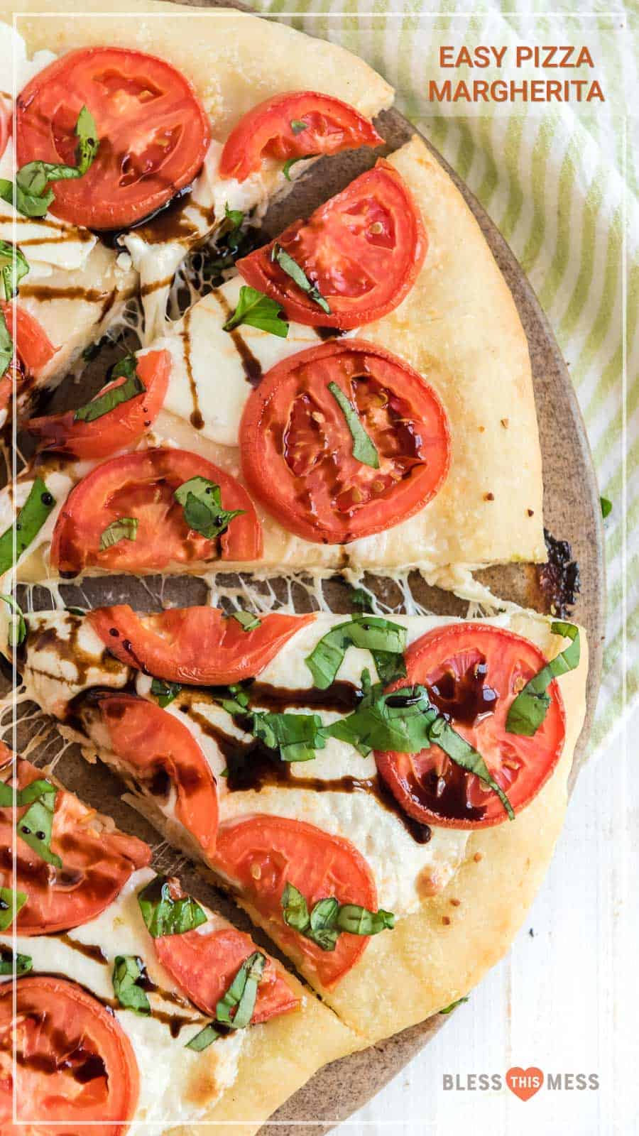 This easy margherita pizza recipe is made of a simple homemade pizza dough with fresh tomato, mozzarella, and basil for a fun and casual meal you can make at home. It's the ideal meal for a busy weeknight or a low-key movie night on the weekend, and it's beyond simple to make from scratch with minimal ingredients. #pizza #margheritapizza #margheritapizzarecipe #pizzarecipe #homemadepizza #homemadepizzadough #pizzadoughrecipe