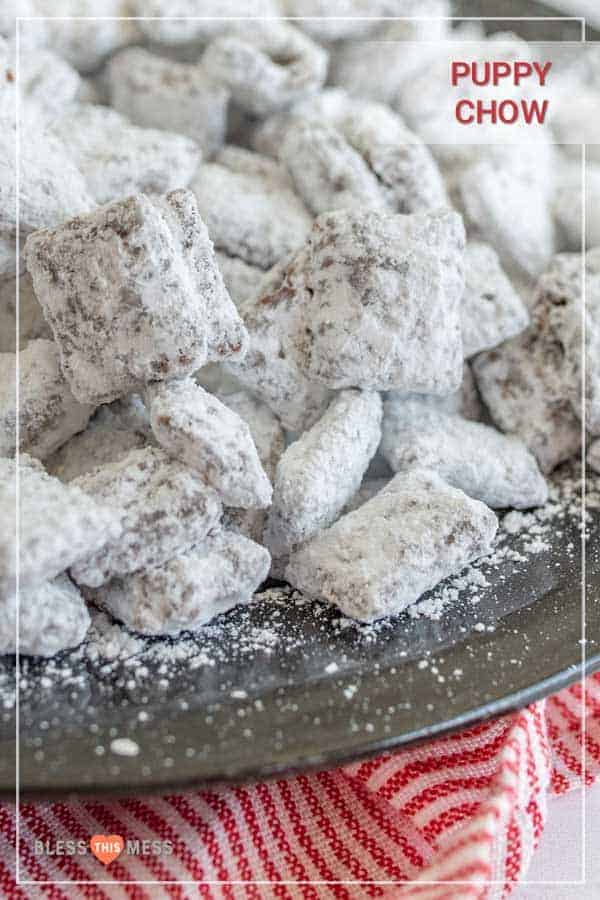 Puppy chow with peanut butter, chocolate, Chex, and powdered sugar is one of the most fun sweet treats ever, and it comes together quickly for a crunchy dessert, easy goody bag, or delicious after-school snack! This homemade puppy chow recipe is one of the simplest and most fun treats to make. I love getting the kids involved because it's so straightforward and a great way to get them interested in cooking and baking! #puppychowrecipe #puppychow #muddybuddies #chexcereal #simpledesserts