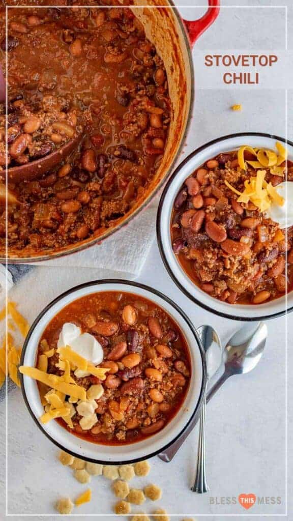 top view of two bowls of chili with cheese