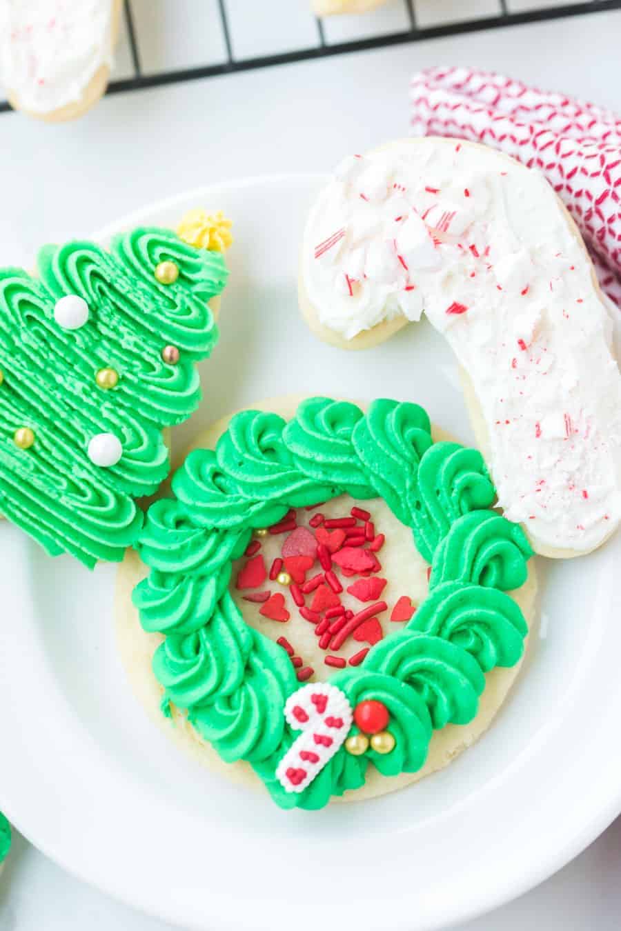 These perfect sugar cookies are moist and soft but keep their shape well, and are perfect for any holiday occasion! They're simple to make, too. Just make the dough, chill it, roll it, shape it, and bake it! And of course, don't forget to decorate it. #sugarcookies #sugarcookie #sugarcookierecipe #baking #cookies #cookierecipe #christmascookies