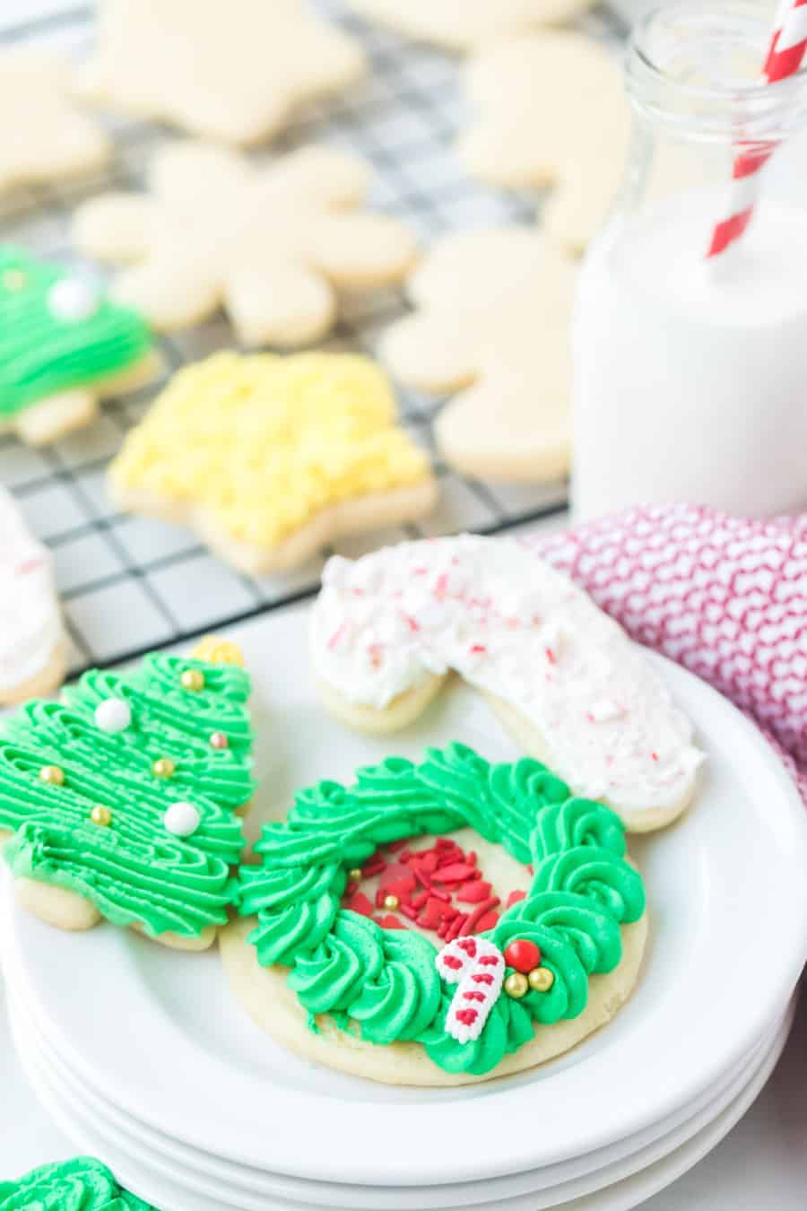 These perfect sugar cookies are moist and soft but keep their shape well, and are perfect for any holiday occasion! They're simple to make, too. Just make the dough, chill it, roll it, shape it, and bake it! And of course, don't forget to decorate it. #sugarcookies #sugarcookie #sugarcookierecipe #baking #cookies #cookierecipe #christmascookies