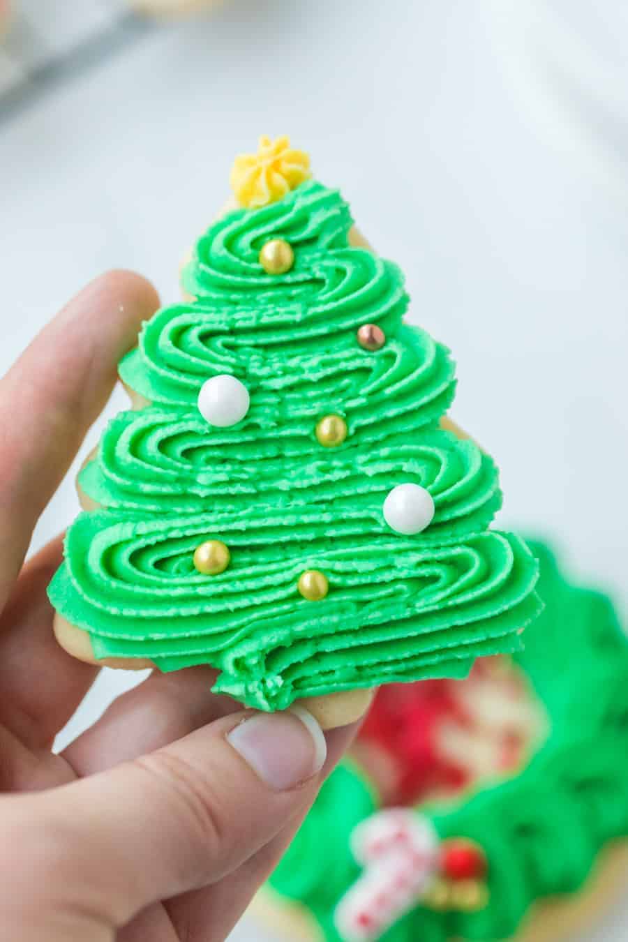 These perfect sugar cookies are moist and soft but keep their shape well, and are perfect for any holiday occasion! They're simple to make, too. Just make the dough, chill it, roll it, shape it, and bake it! And of course, don't forget to decorate it. #sugarcookies #sugarcookie #sugarcookierecipe #baking #cookies #cookierecipe #christmascookies