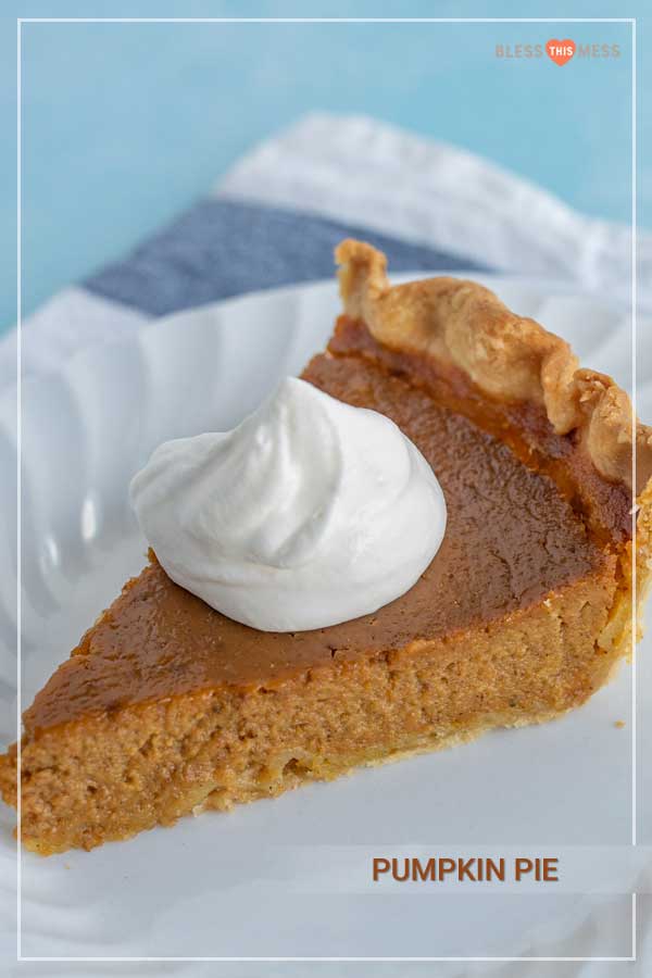 slice of pumpkin pie and whipped cream