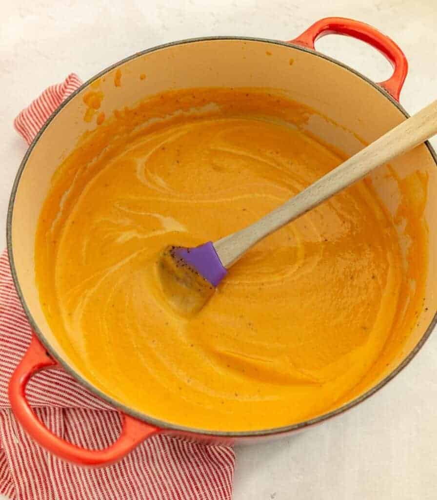 cast iron dutch oven pot of creamy carrot soup