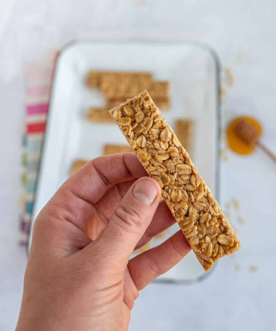 woman holding homemade granola bar