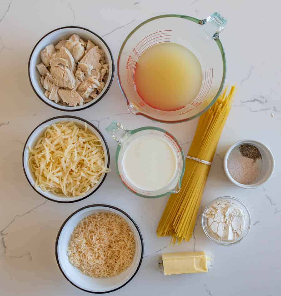 An overhead shot of all the ingredients you will need for turkey tetrazzini, including, turkey, cheese, milk, noodles, butter, etc.