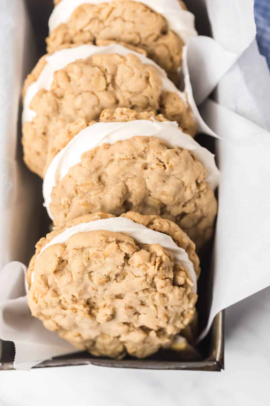 pan of homemade oatmeal cream pie cookies on parchment