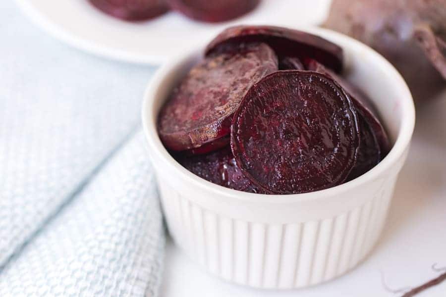 pile of roasted beet slices in a little white dish