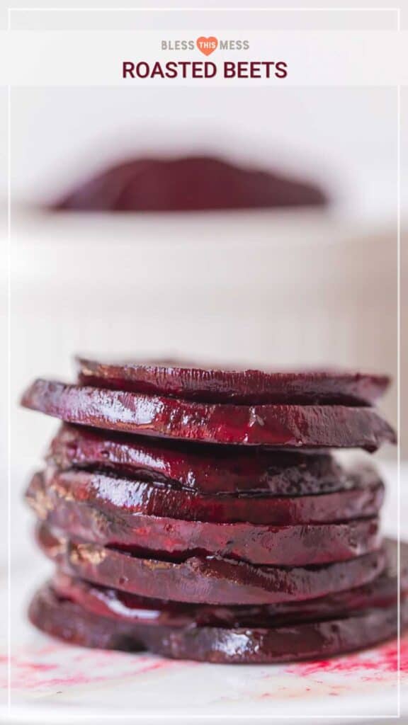 Roasted beets stacked on white plate