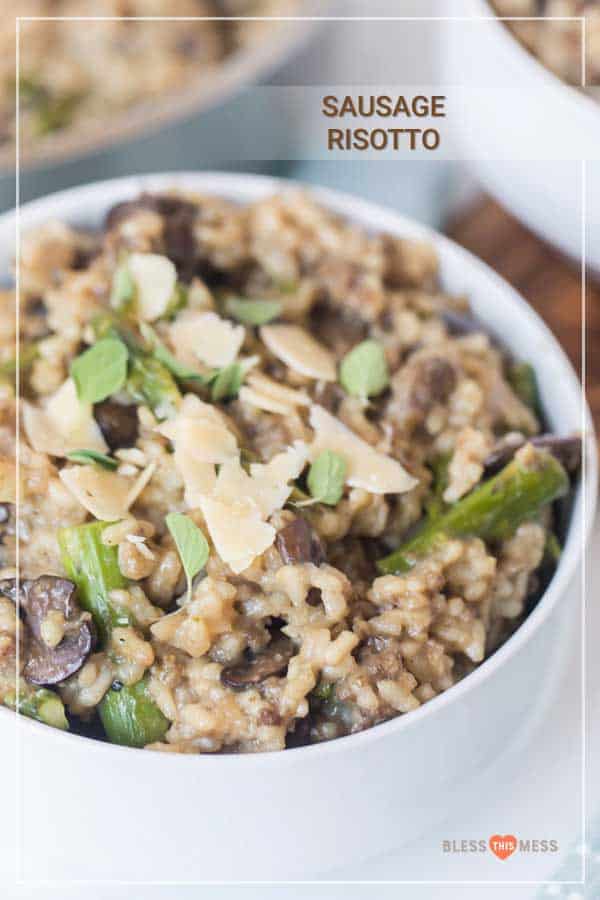 sausage risotto with asparagus and Parmesan in white bowl