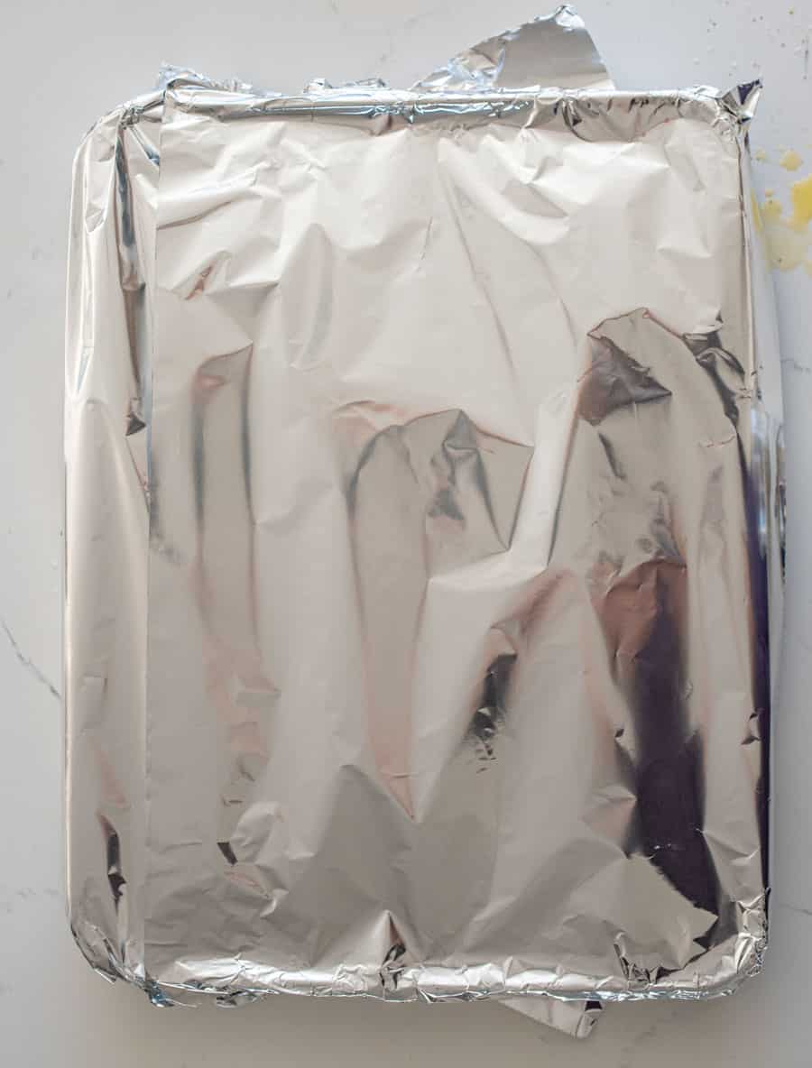 baking dish wrapped in aluminum foil.