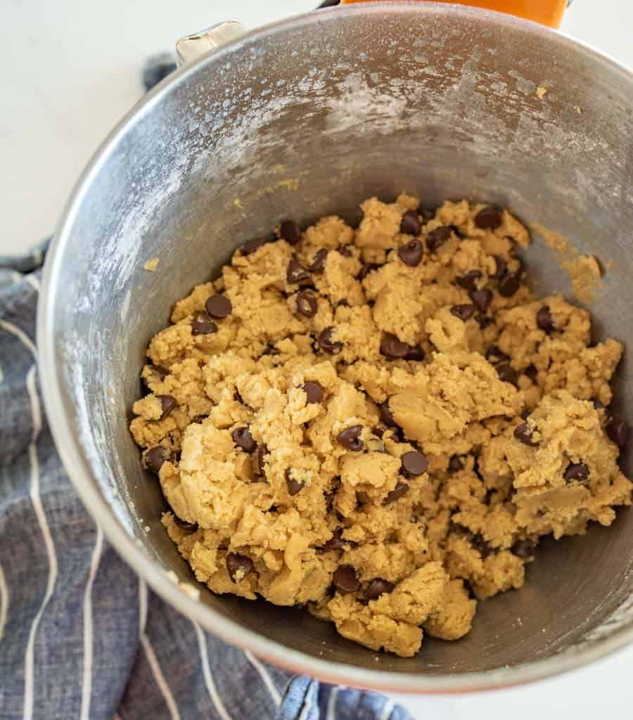 chocolate chip cookie dough in a metal mixer bowl