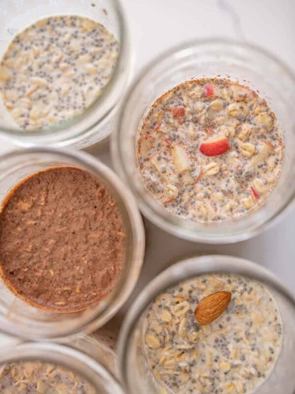 top view of various flavors inside wide mouth mason jars of overnight oats