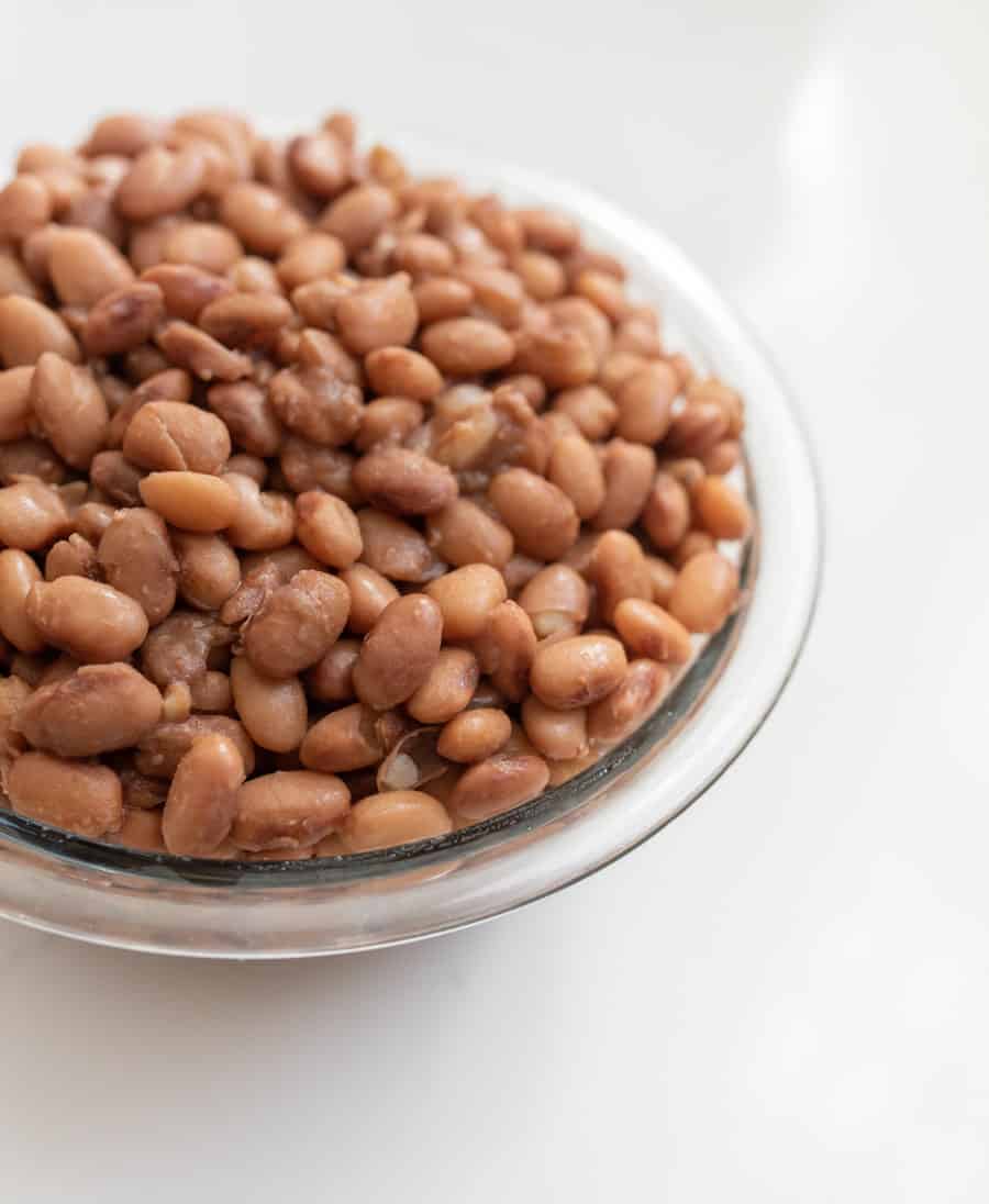 clear glass bowl of cooked pinto beans