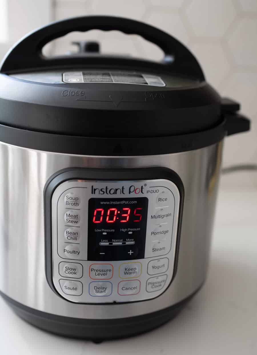 instant pot sitting on white counter top