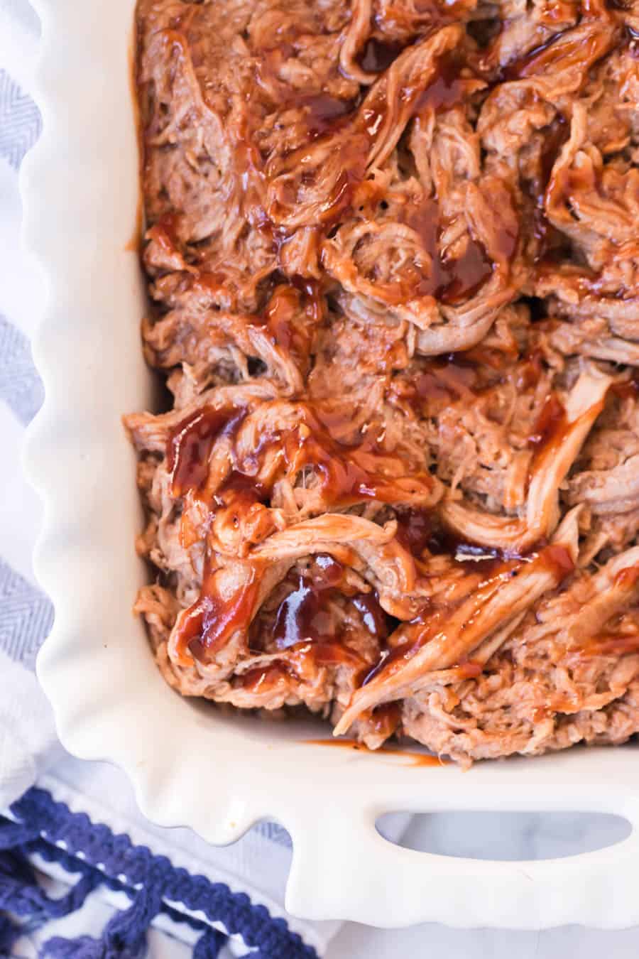 white casserole dish with barbecue pulled pork.