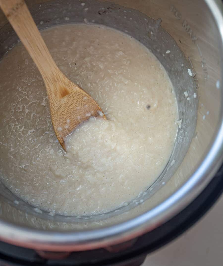 rice pudding in the instant pot with wooden spoon