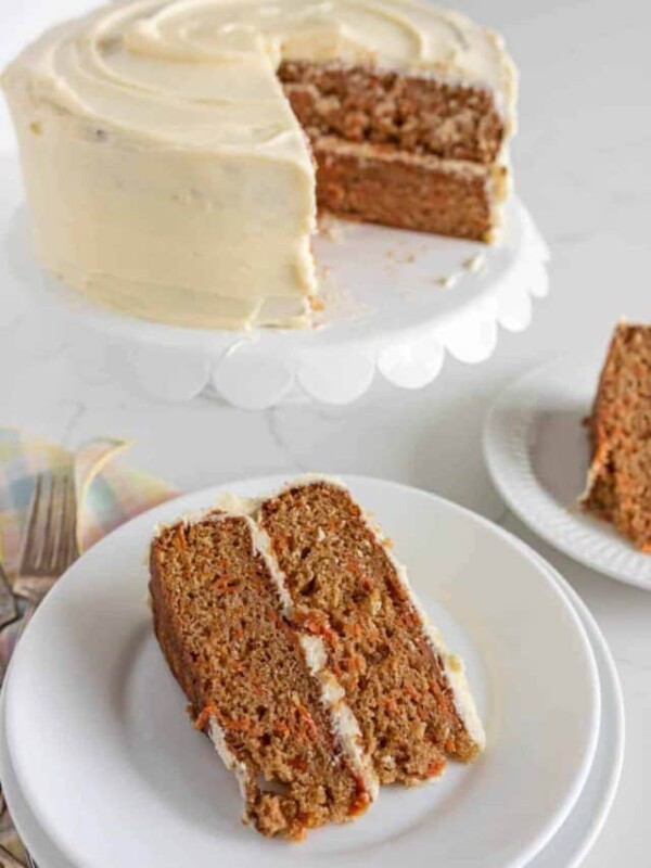 carrot cake with a slice on a plate