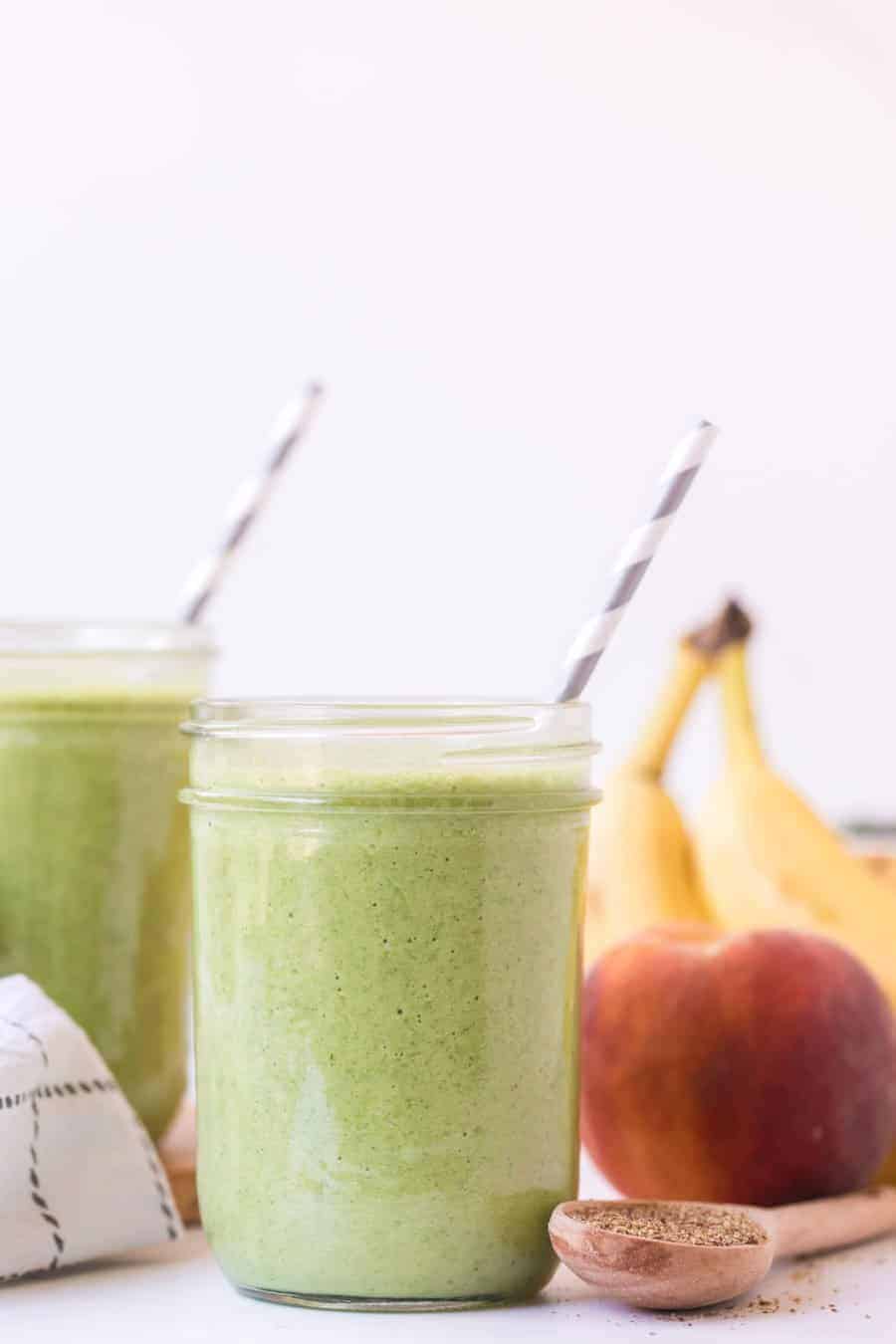 a green smoothie in a wide mouth mason jar