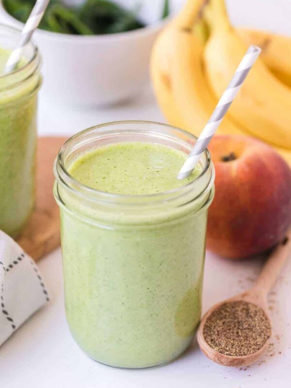 a green smoothie in a wide mouth mason jar