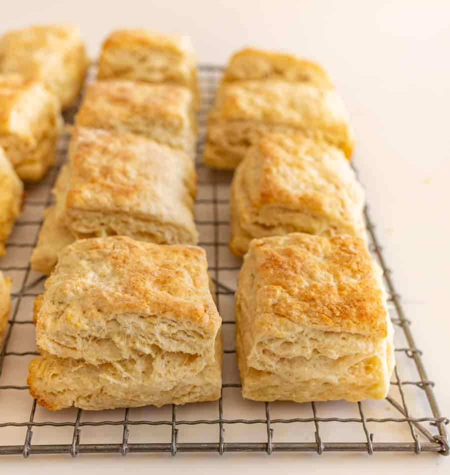 quick sourdough biscuits on cooling rack on white countertop