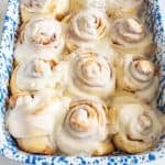 Same Day Sourdough Cinnamon Rolls closeup images in blue and white pan