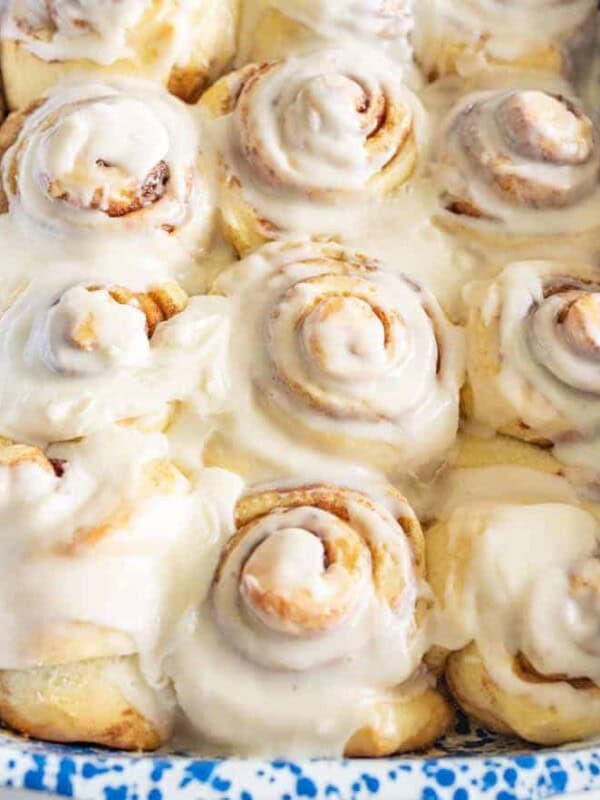 Same Day Sourdough Cinnamon Rolls closeup images in blue and white pan